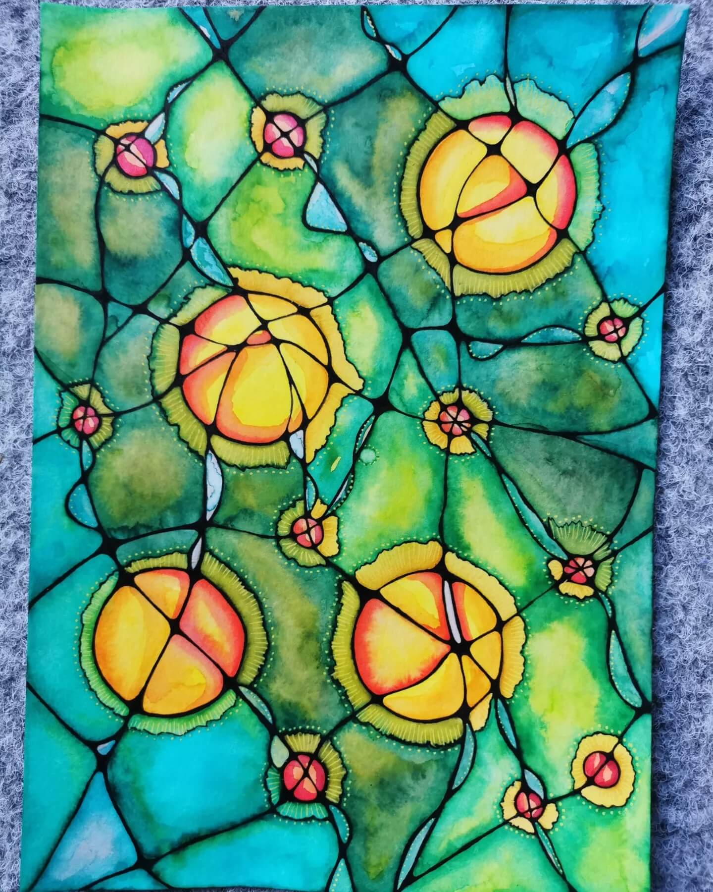 A stained glass image with yellow flowers.