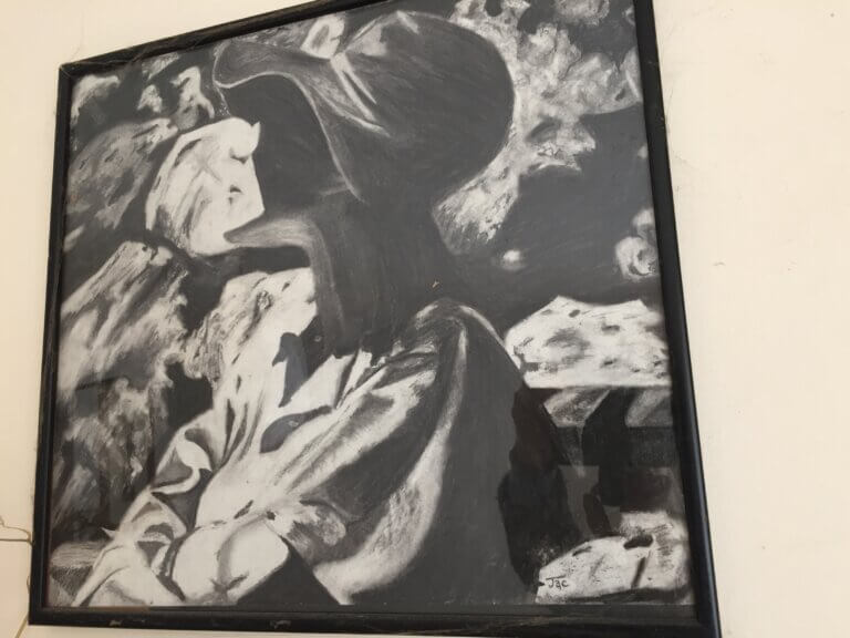 A black and white painting of someone wearing a hat staring at the sky