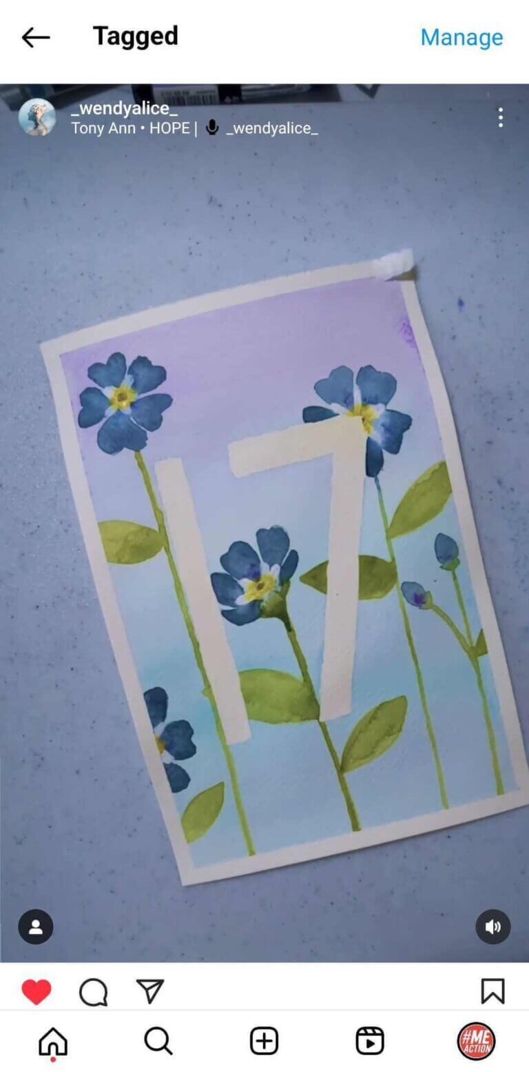 screenshot of a post that features a painting of the number 17 on a blue background with blue flowers.
