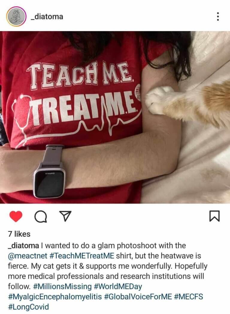 instagram post of a person wearing a teach me treat me shirt and an apple watch. There is a cat paw stretched out and resting on her arm. The post talks about taking a photo.