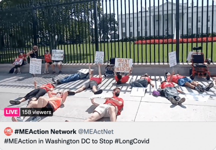 People lying on the sidewalk in front of the white house
