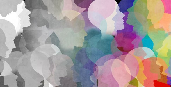 Multiple head silhouettes in a gradation from grey and white to a rainbow of colors.